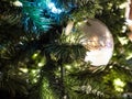 Shiny ball on decorated Christmas tree at night Royalty Free Stock Photo