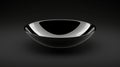 A shiny black bowl with a smooth surface. Royalty Free Stock Photo