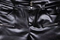 Shiny black fake leather trousers with silver buttons Royalty Free Stock Photo