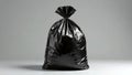 Shiny black garbage bag on gray background Royalty Free Stock Photo