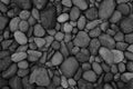 black stone, Shiny black lava pebbles on the beach, Black lava pebble stone Royalty Free Stock Photo