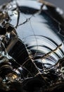 Shiny black obsidian with visible conchoidal fractures and reflective surfaces. The Royalty Free Stock Photo