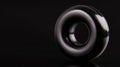 A shiny black ring with a hole in the middle. Royalty Free Stock Photo