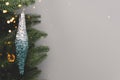 Shiny blue Christmas icicle hanging on a fir branch. Royalty Free Stock Photo