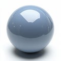 Shiny blue sphere placed on a plain surface reflecting light in a minimalist setting Royalty Free Stock Photo