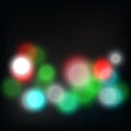 Shiny bokeh lights blur abstract background vector. Bright red, blue, green and white Christmas bulb art. Royalty Free Stock Photo