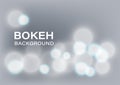 Shiny Bokeh Lights Blur Abstract Background Vector. Bright white Christmas bulb with soft gray color backdrop. Royalty Free Stock Photo