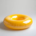 Bright yellow inflatable swimming ring isolated on white background, studio shot Royalty Free Stock Photo