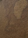 Texture of shiny brown stone. Sandstone, macro shot. Royalty Free Stock Photo
