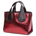 Shiny burgundy or red women`s bag with brown handles, on a white background Royalty Free Stock Photo