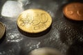 Shiny 50 cents euro coin close up on a glass table