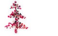 Shiny Christmas tree isolate. Figure of a Christmas tree on a white background of shiny multi-colored confetti. Happy new year and Royalty Free Stock Photo