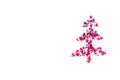 Shiny Christmas tree isolate. Figure of a Christmas tree on a white background of shiny multi-colored confetti. Happy new year and Royalty Free Stock Photo