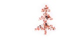 Shiny Christmas tree isolate. Figure of a Christmas tree on a white background of shiny multi-colored confetti. Happy new year and Royalty Free Stock Photo