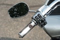 Shiny chrome motorcycle parts close-up. A large tourist motorbike. The handlebar and control panel of the new motorcycle Royalty Free Stock Photo