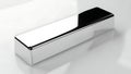 Shiny chrome rectangular prism object on a white reflective surface Royalty Free Stock Photo