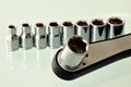 Shiny chrome steel wrench tool and sockets. close up view Royalty Free Stock Photo