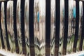 Shiny chromed front radiator grill of classic luxury car.