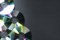 Shiny compact discs on grey background, top view. Space for text Royalty Free Stock Photo