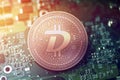 Shiny copper DIGIBYTE cryptocurrency coin on blurry motherboard background