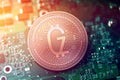 Shiny copper GODZILLION cryptocurrency coin on blurry motherboard background