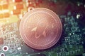 Shiny copper STELLAR cryptocurrency coin on blurry motherboard background Royalty Free Stock Photo