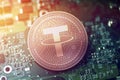 Shiny copper TETHER cryptocurrency coin on blurry motherboard background
