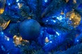 Shiny dark blue Christmas ball on the Christmas tree Royalty Free Stock Photo