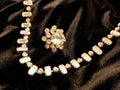 Shiny diamond jewelry necklace on black satin background for valentines day. Royalty Free Stock Photo