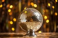 Shiny disco ball on table against blurred background, colorful Royalty Free Stock Photo