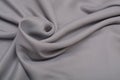 Shiny elegant silver satin silk fabric background Royalty Free Stock Photo