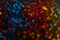 Shiny Festive Background. Lots of Flashing colorful spots.colorful bokeh background. Multicolored garlands on a black