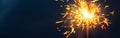 shiny fire sparkler on dark blue background Royalty Free Stock Photo