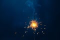 shiny fire sparkler on dark blue background Royalty Free Stock Photo