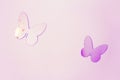 Shiny flying butterflies with wings on a purple background