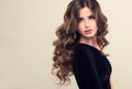 Shiny, freely laying curls of well groomed hair. Beauty portrait of young, perfektly looking woman. Royalty Free Stock Photo