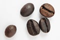 Shiny freshly roasted coffee beans on a white background. Isolated Royalty Free Stock Photo