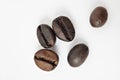 Shiny freshly roasted coffee beans on a white background. Isolated Royalty Free Stock Photo