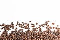 Shiny freshly roasted coffee beans on a white background. Isolated Royalty Free Stock Photo