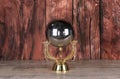 shiny geometric metallic ball on wooden