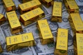 Shiny gold bars and american dollar banknotes close up. Shiny precious metals for investments or reserves.
