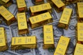 Shiny gold bars and american dollar banknotes close up. Shiny precious metals for investments or reserves.