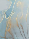 Luxury abstract fluid art painting background alcohol ink technique blue and gold. Swirls of shiny gold edges. Royalty Free Stock Photo