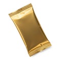 A shiny gold wrapper of a chocolate bar standing upright against a white background Royalty Free Stock Photo