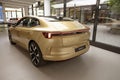 Shiny golden car Polestar 4 upcoming all-electric SUV coupe by Polestar, Volvo subsidiary, long-range, luxurious, eco-friendly