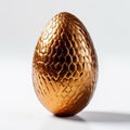 Shiny Golden Egg On White Surface - Intricately Textured Dark Orange And Bronze Egg