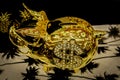 Shiny golden piggy bank with reflections and rhinestone dollar sign viewed from above