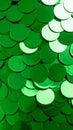 Shiny green metallic round confetti sequins creating a festive abstract texture background Royalty Free Stock Photo
