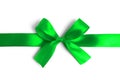 Shiny green satin ribbon on white background