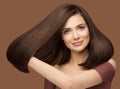 Shiny Hair Beauty Woman. Brunette Model Showing Glossy Silky Straight Hairstyle. Fashion Girl Portrait with Natural Make up Royalty Free Stock Photo